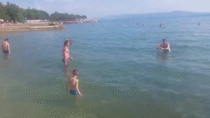 Guys trying to play frisbee and failing