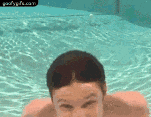Guy swimming into glass