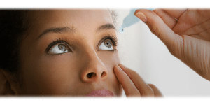 Patient putting in drops for dry eye